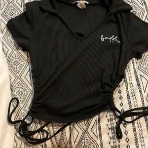 Black shirt with caller on top with strings on side